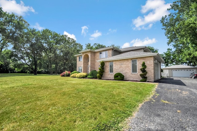 15516 Frontage Rd, Markham, IL 60428 - view of front of property featuring brick siding, a front lawn, an outdoor structure, and a detached garage