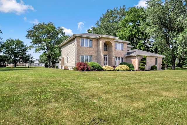 15516 Frontage Rd, Markham, IL 60428 - view of front of house featuring a front lawn and brick siding
