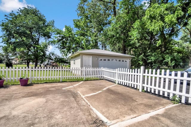 15516 Frontage Rd, Markham, IL 60428 - view of patio / terrace with an outbuilding, a fenced front yard, and a detached garage