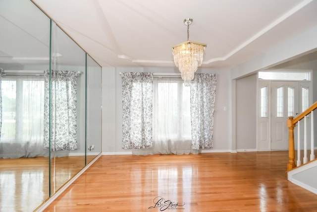 15516 Frontage Rd, Markham, IL 60428 - empty room with a chandelier, stairway, and wood finished floors