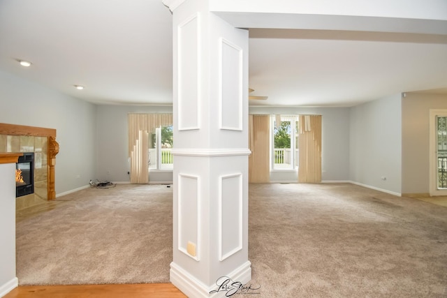 15516 Frontage Rd, Markham, IL 60428 - unfurnished living room featuring light colored carpet, a tiled fireplace, and ceiling fan
