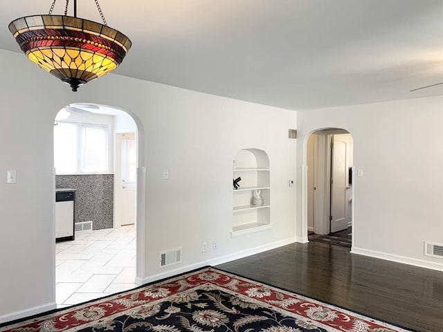 652 Beckman Dr, Kankakee, IL 60901 - unfurnished room with built in features and arched walkways