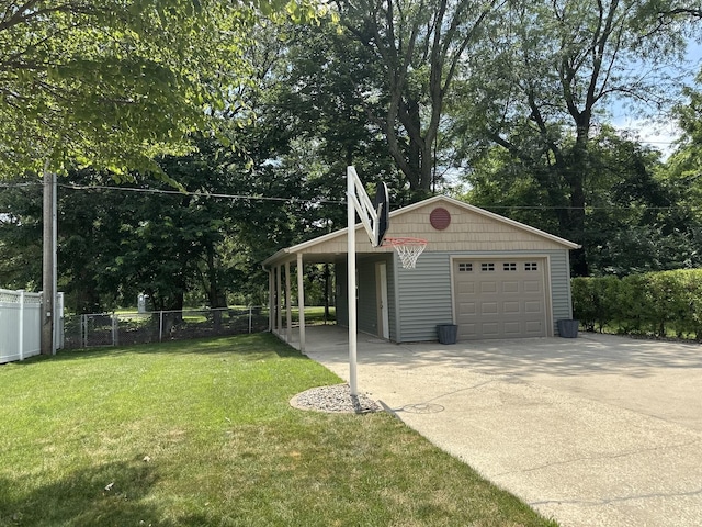 652 Beckman Dr, Kankakee, IL 60901 - garage with a detached garage, concrete driveway, and view of scattered trees