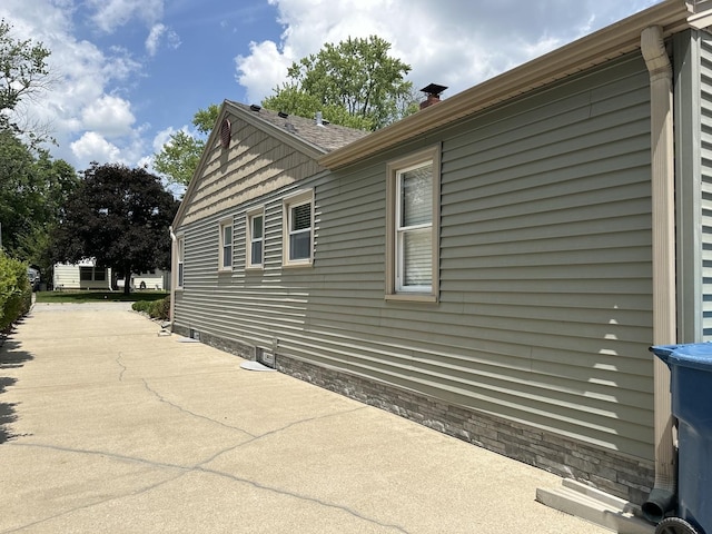 652 Beckman Dr, Kankakee, IL 60901 - view of home's exterior featuring a chimney