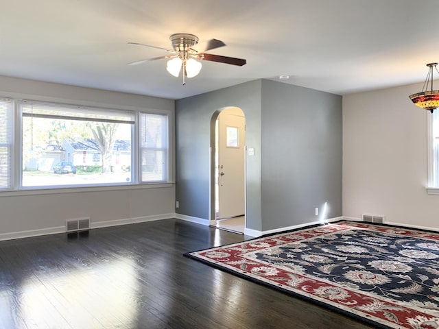 652 Beckman Dr, Kankakee, IL 60901 - entrance foyer with arched walkways, ceiling fan, and wood finished floors