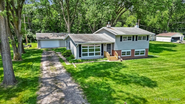 4421 Elmleaf Dr, Mchenry, IL 60051 - split level home with a chimney, a detached garage, brick siding, and a front lawn