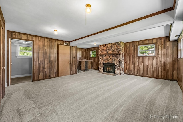 4421 Elmleaf Dr, Mchenry, IL 60051 - unfurnished living room featuring wooden walls, a fireplace, carpet flooring, and beamed ceiling
