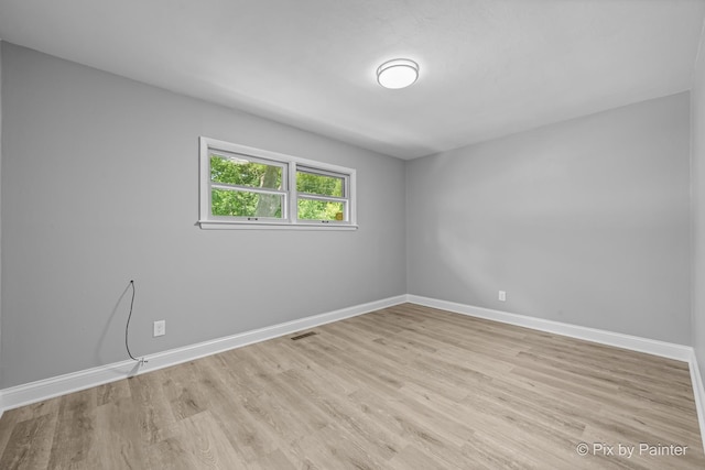 4421 Elmleaf Dr, Mchenry, IL 60051 - spare room with light wood-style flooring and baseboards