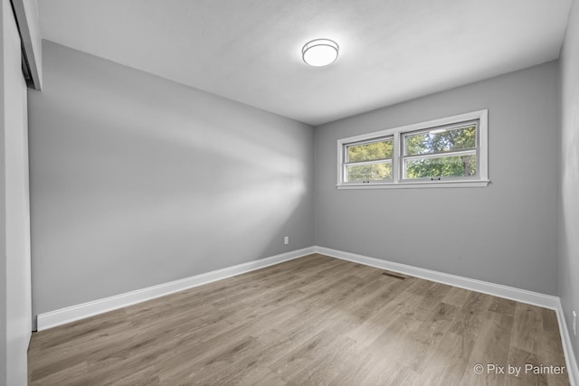 4421 Elmleaf Dr, Mchenry, IL 60051 - spare room with wood finished floors and baseboards