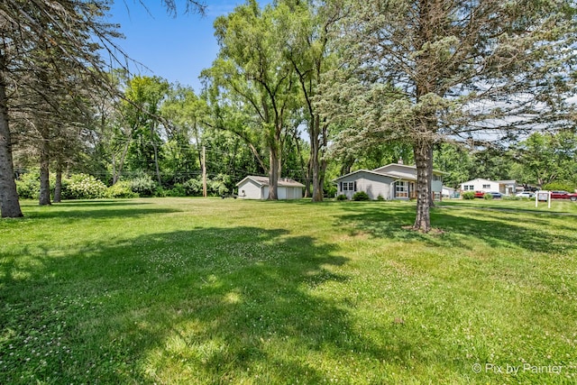 4421 Elmleaf Dr, Mchenry, IL 60051 - view of grassy yard with view of wooded area