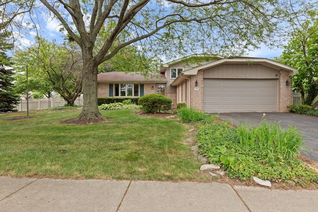13635 W Ironwood Cir, Homer Glen, IL 60491 - view of front of property with brick siding, asphalt driveway, and a garage