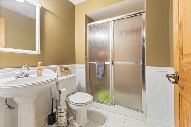 13635 W Ironwood Cir, Homer Glen, IL 60491 - bathroom featuring a wainscoted wall, a shower stall, and tile patterned floors