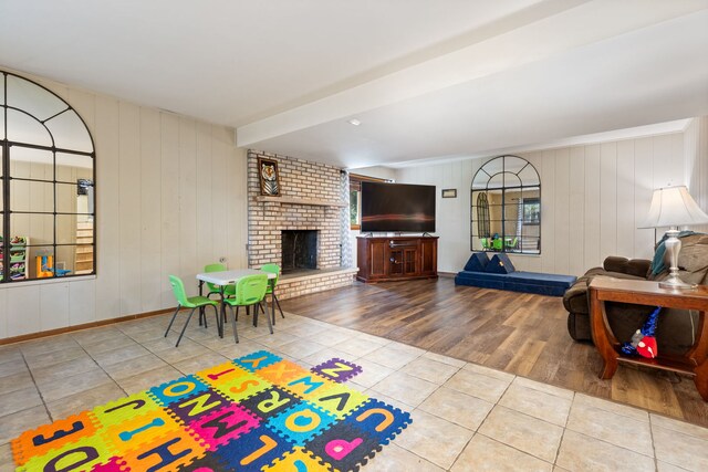 13635 W Ironwood Cir, Homer Glen, IL 60491 - tiled living room featuring a fireplace and wood walls