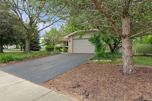 13635 W Ironwood Cir, Homer Glen, IL 60491 - view of front of home with brick siding, an attached garage, and driveway