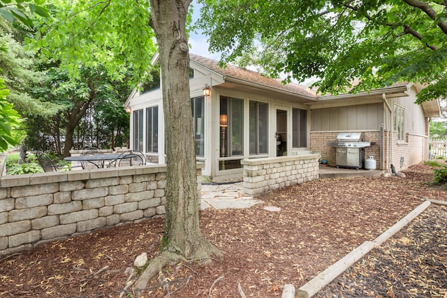 13635 W Ironwood Cir, Homer Glen, IL 60491 - view of property exterior featuring a sunroom and brick siding