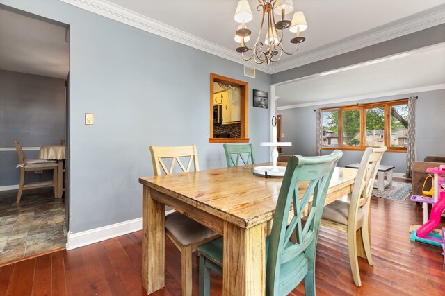13635 W Ironwood Cir, Homer Glen, IL 60491 - dining space featuring hardwood / wood-style floors, a chandelier, and crown molding