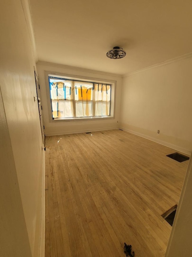2854 S Central Park Ave, Chicago, IL 60623 - empty room featuring crown molding and hardwood / wood-style floors