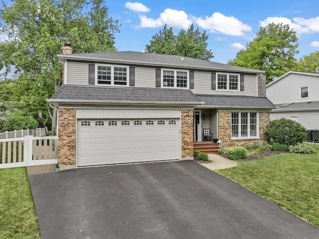 1507 Eton Ln, Naperville, IL 60565 - traditional home featuring brick siding, a chimney, driveway, and a garage