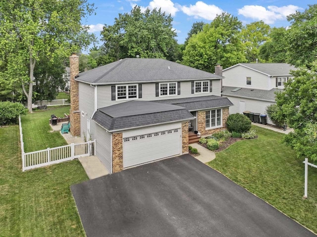1507 Eton Ln, Naperville, IL 60565 - view of front of property with a chimney, driveway, brick siding, and roof with shingles