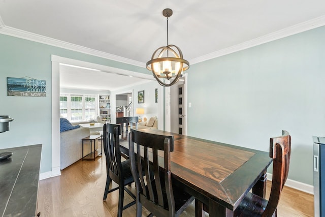 1507 Eton Ln, Naperville, IL 60565 - dining room featuring crown molding, light wood-style flooring, and a chandelier