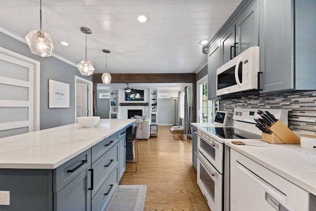 1507 Eton Ln, Naperville, IL 60565 - kitchen featuring white appliances, open floor plan, gray cabinetry, a kitchen island, and light wood-style flooring