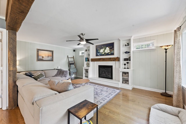 1507 Eton Ln, Naperville, IL 60565 - living room with wood finished floors, ceiling fan, a glass covered fireplace, and crown molding