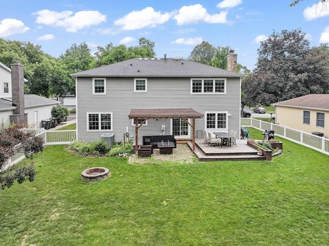 1507 Eton Ln, Naperville, IL 60565 - rear view of house featuring an outdoor living space with a fire pit, a wooden deck, a fenced backyard, and a chimney
