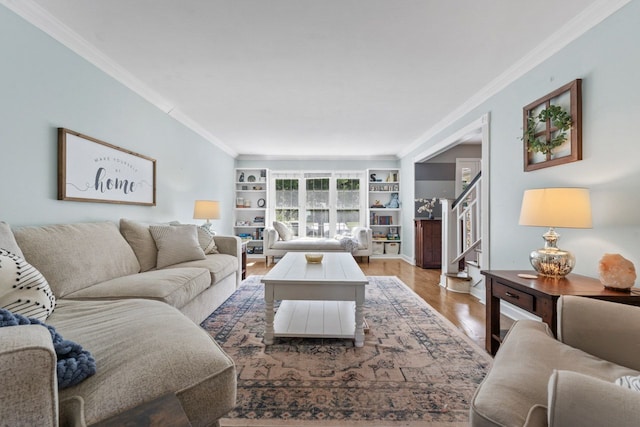 1507 Eton Ln, Naperville, IL 60565 - living room featuring ornamental molding, light wood finished floors, and stairway