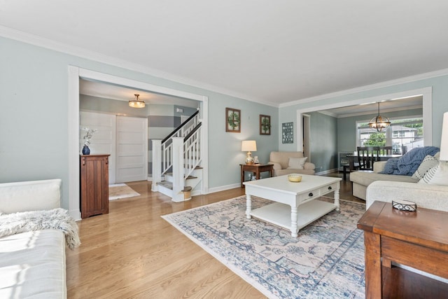 1507 Eton Ln, Naperville, IL 60565 - living room with crown molding, light wood-style flooring, stairway, and a chandelier