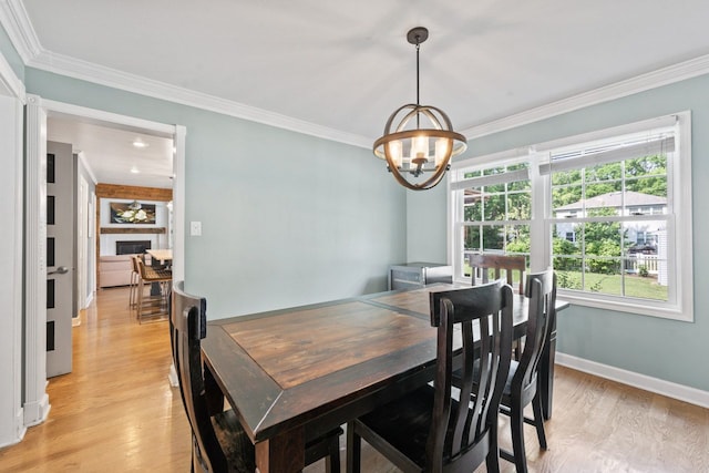 1507 Eton Ln, Naperville, IL 60565 - dining area featuring a chandelier, light wood-type flooring, and crown molding