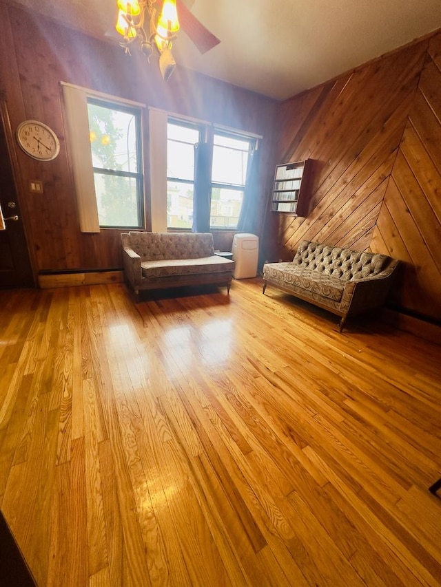 4817 W 28th St, Cicero, IL 60804 - sitting room featuring wood finished floors, healthy amount of natural light, and wood walls