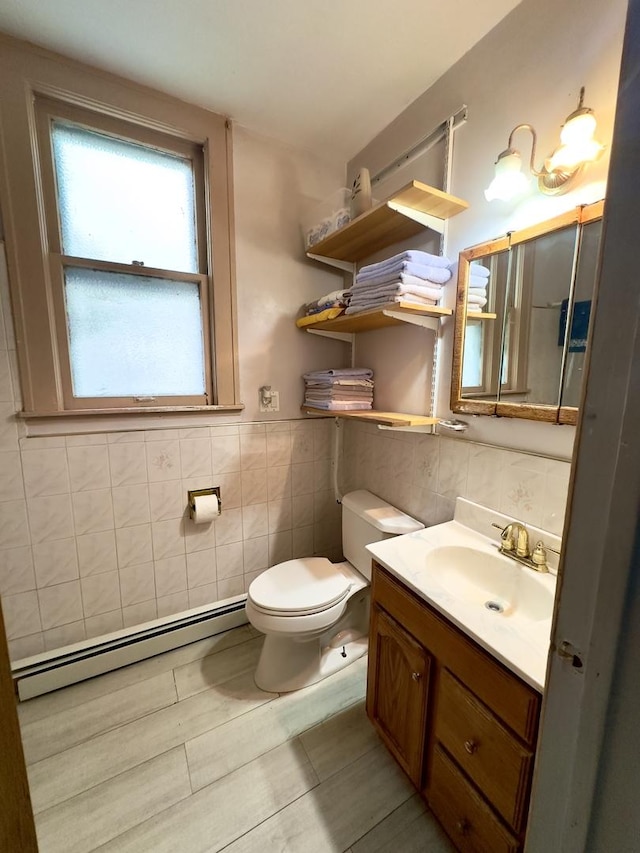 4817 W 28th St, Cicero, IL 60804 - bathroom featuring baseboard heating, tile walls, and vanity