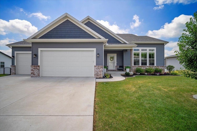 507 Raef Rd, Downs, IL 61736 - craftsman house with a garage, a front yard, driveway, and brick siding