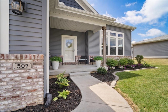507 Raef Rd, Downs, IL 61736 - property entrance featuring a porch and a yard