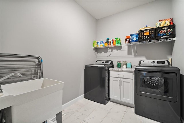 507 Raef Rd, Downs, IL 61736 - washroom featuring light marble finish floors, washer and clothes dryer, and cabinet space