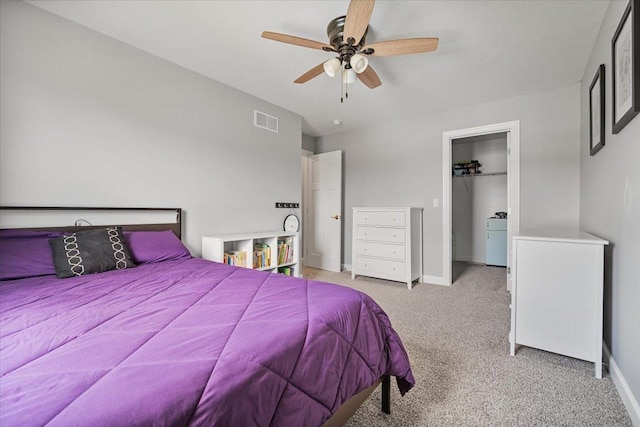 507 Raef Rd, Downs, IL 61736 - bedroom with light carpet, a ceiling fan, and a spacious closet