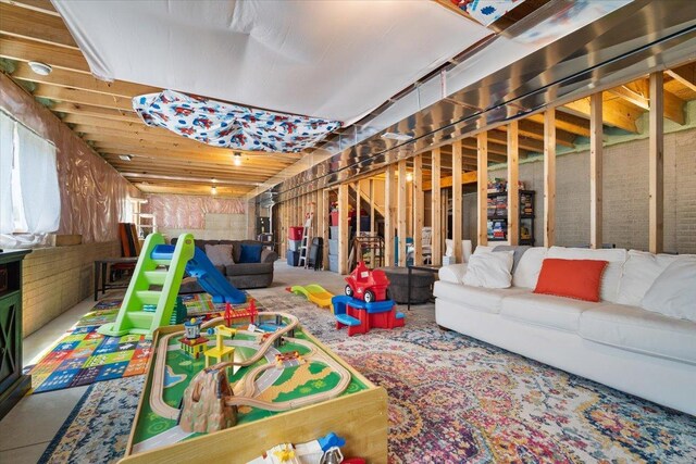 507 Raef Rd, Downs, IL 61736 - recreation room featuring carpet