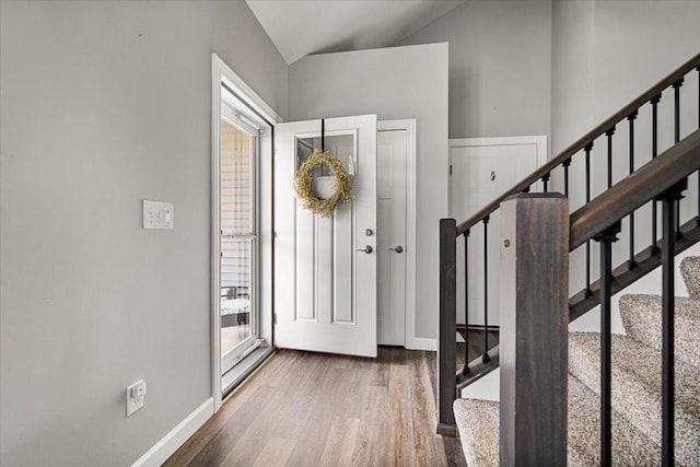 507 Raef Rd, Downs, IL 61736 - entrance foyer featuring wood finished floors, stairway, and lofted ceiling