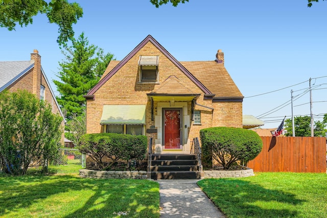 11341 S Spaulding Ave, Chicago, IL 60655 - tudor house featuring brick siding and a shingled roof