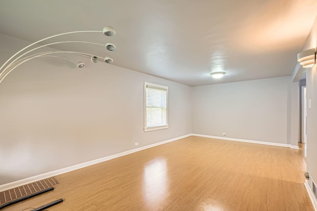 11341 S Spaulding Ave, Chicago, IL 60655 - unfurnished room with light wood-style floors and baseboards