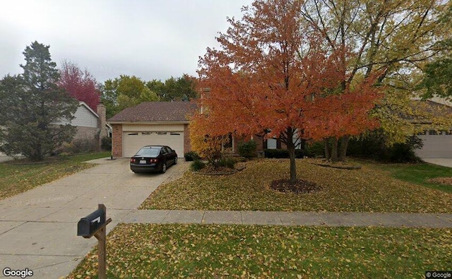 8221 Meadowwood Ave, Woodridge, IL 60517 - view of property hidden behind natural elements featuring an attached garage, concrete driveway, and a front lawn