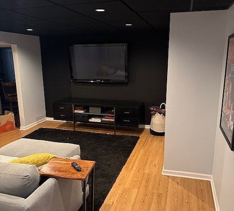 8221 Meadowwood Ave, Woodridge, IL 60517 - living room with wood finished floors, a paneled ceiling, and recessed lighting