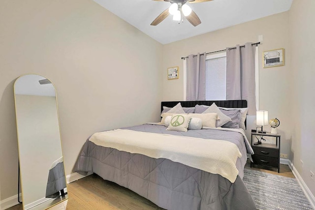 2355 W Congress Pkwy Unit 1, Chicago, IL 60612 - bedroom with wood finished floors, a ceiling fan, and arched walkways