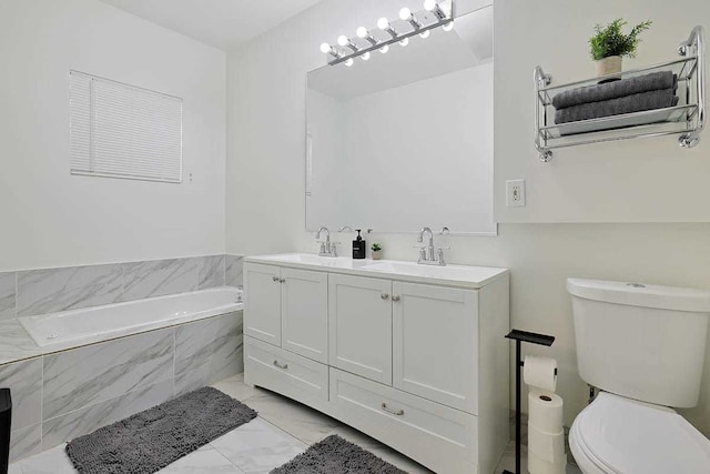 2355 W Congress Pkwy Unit 1, Chicago, IL 60612 - bathroom featuring marble finish flooring, a garden tub, and double vanity