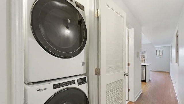2355 W Congress Pkwy Unit 1, Chicago, IL 60612 - laundry area with stacked washer / dryer and light wood finished floors