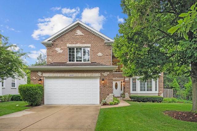 2210 Center Ave, Northbrook, IL 60062 - view of front of property featuring an attached garage, concrete driveway, a front yard, and brick siding