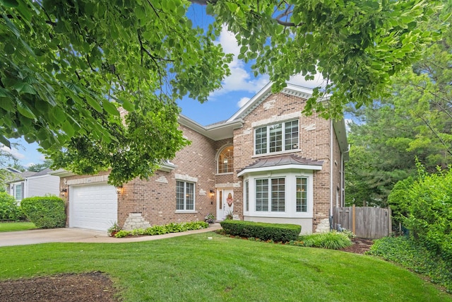 2210 Center Ave, Northbrook, IL 60062 - traditional-style house with an attached garage, brick siding, and driveway