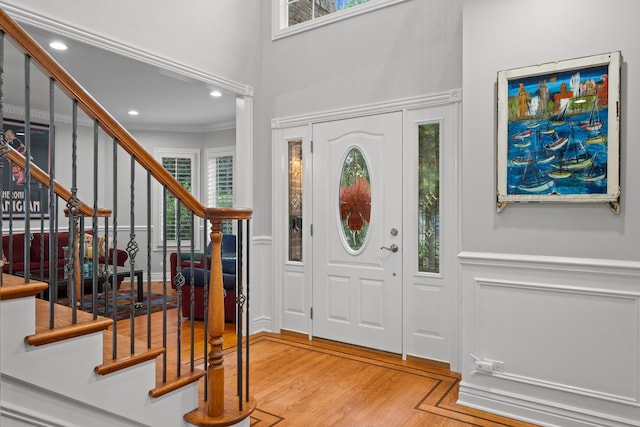 2210 Center Ave, Northbrook, IL 60062 - foyer featuring stairway, wood finished floors, ornamental molding, a towering ceiling, and recessed lighting
