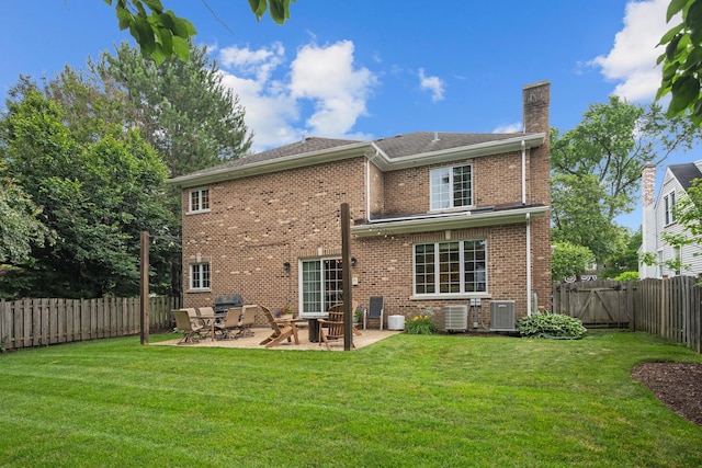 2210 Center Ave, Northbrook, IL 60062 - back of house featuring a chimney, a patio area, a fenced backyard, brick siding, and a gate