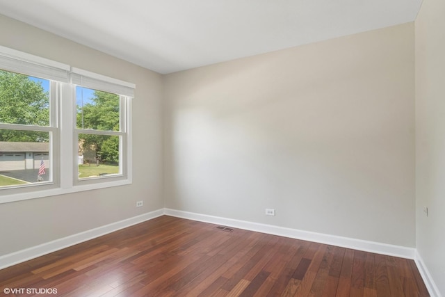 4325 Sandlewood Ln, Hoffman Estates, IL 60192 - unfurnished room with baseboards and dark wood-style flooring